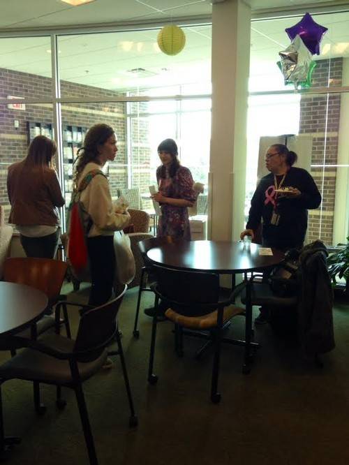 4 women conversing in the women's center